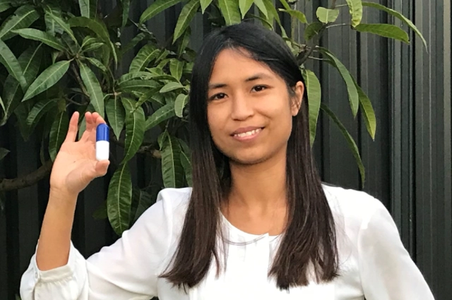 Michelle Ta holding capsule