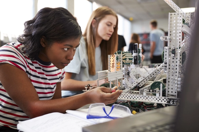 Girl Focused On Screwdriving Brackets Resized