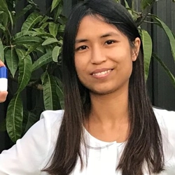 Michelle Ta holding capsule