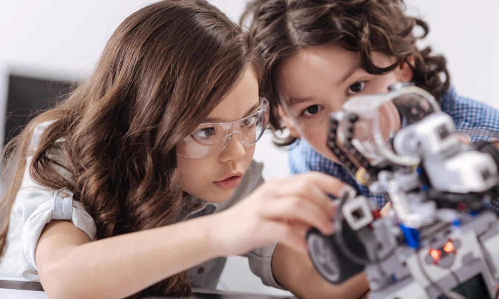 Two children looking at an automatic part