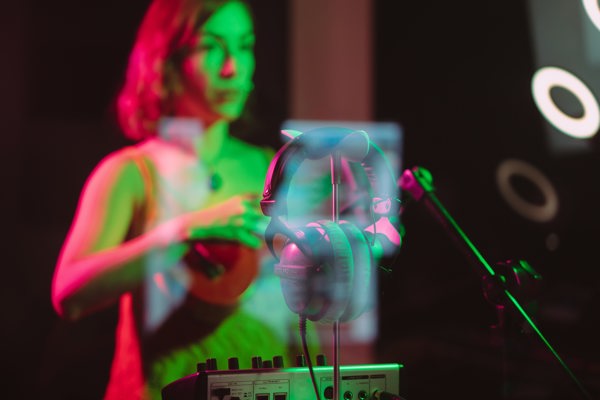 Musician in a colourful music studio playing an instrument