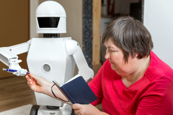 Person holding a notebook is reaching for the pen held by a robot