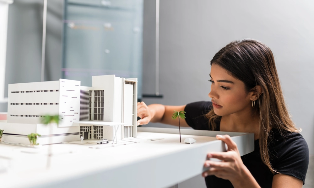 Woman looking at an architectural model