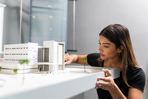 Woman looking at an architectural model